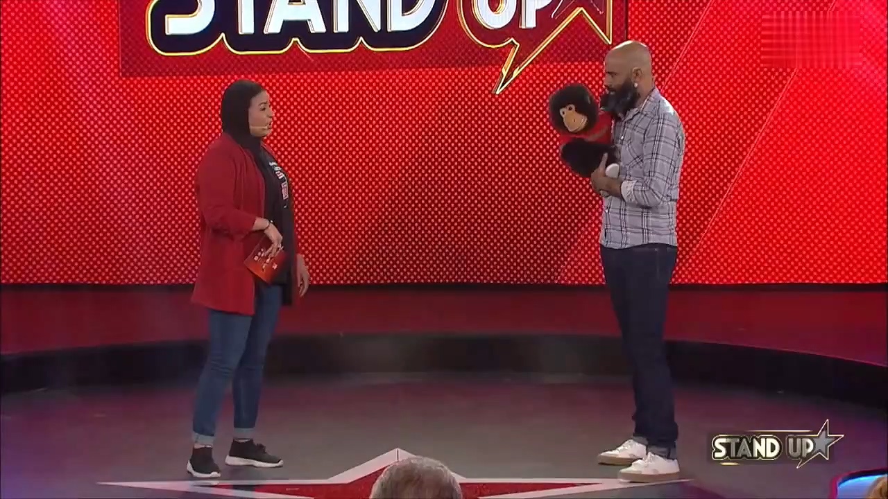 Sofi Aisha and Sharaf Al Sarjani stand up
